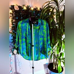 L'AGENCE Dani silk blouse in a green and blue pattern.